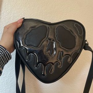 Love pain and stitches small black poison heart bag